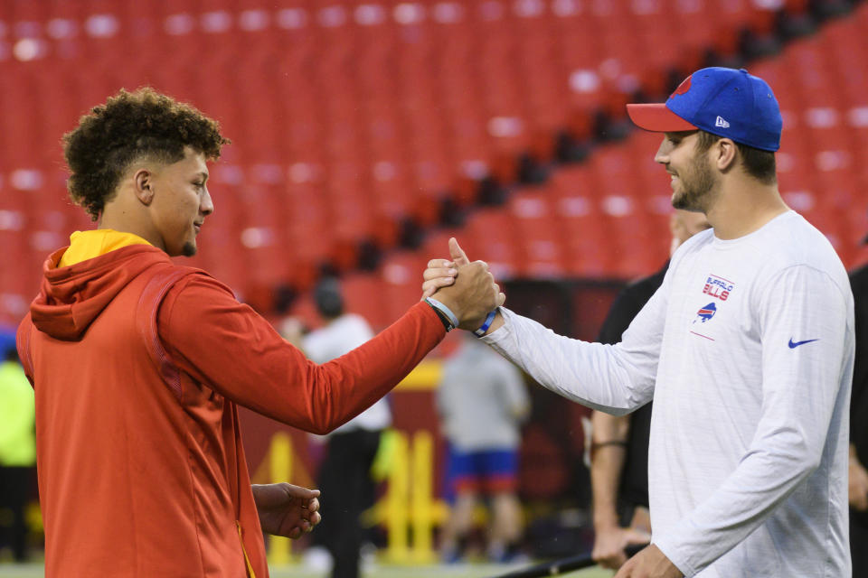 Kansas City Chiefs quarterback Patrick Mahomes, left, greets Buffalo Bills quarterback Josh Allen during pre-game warmups before an NFL football game, Sunday, Oct. 10, 2021 in Kansas City, Mo. (AP Photo/Reed Hoffmann)