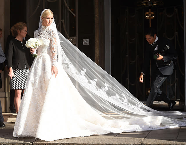 This has to be one of the best celebrity wedding dresses we've ever seen. Nicky Hilton looked gorgeous in a lacy, long-sleeved Valentino Couture wedding gown on Friday, as she stepped out of her London hotel headed to marry banking heir James Rothschild at Kensington Palace. FameFlynet <strong>PHOTOS: Beautiful Brides -- The Best Celebrity Wedding Dresses</strong> FameFlynet Check out the 31-year-old socialite's amazing train. FameFlynet Nicky had quite the hand in designing the gown as well. "Ever since I was a little girl I wanted Valentino to design my wedding dress. Valentino is the definition of timeless elegance, I don't think there's another couture house like it," she told Harper's Bazaar. <strong> WATCH: Nicky Hilton Marries James Rothschild in Lavish Ceremony </strong> "I went through every look from their collections over the last 10 years," she added. "I studied the archives, and I just sent notes about details I liked -- a certain sleeve, a high neckline." Valentino And the result -- six months later! -- is absolutely stunning: a custom couture gown with guipure lace, crystal embellishments, a balloon skirt and a nearly 10-foot train. The bride completed her look with a pair of white Christian Louboutins, inscribed with "Mrs. Rothschild." <strong>WATCH: Oops! Nicky Hilton Bares Her Butt in Serious Versace Wardrobe Malfunction</strong> Check out another memorable celebrity wedding dress -- Angelina Jolie's Versace gown when she married longtime love Brad Pitt last September -- in the video below.