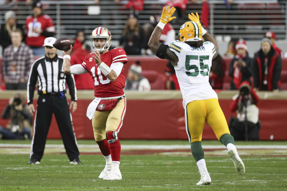 San Francisco 49ers quarterback Jimmy Garoppolo (10) looks downfield for a receiver in the NFL NFC Championship football game against the Green Bay Packers, Sunday, Jan. 19, 2020 in Santa Clara, Calif. The 49ers defeated the Packers 37-20. (Margaret Bowles via AP)