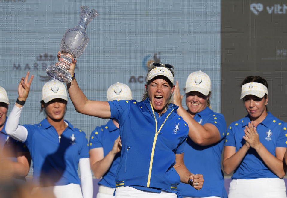 Europe's Team Captain Suzann Pettersen lifts the trophy after wining the Solheim Cup golf tournament in Finca Cortesin, near Casares, southern Spain, Sunday, Sept. 24, 2023. Europe has beaten the United States during this biannual women's golf tournament, which played alternately in Europe and the United States. (AP Photo/Bernat Armangue)