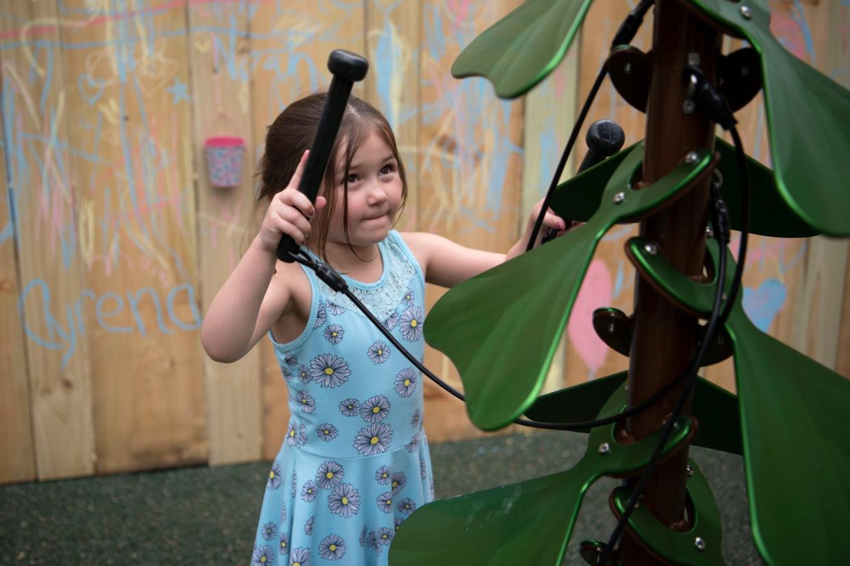 Micah Payne, 5, plays in the new music garden at Binder Park Zoo in Battle Creek, Michigan on Tuesday, May 10, 2022.