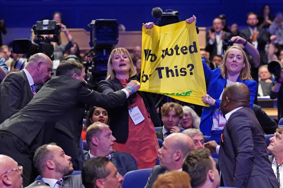 The demonstration during Prime Minister Liz Truss’ speech during the Conservative Party annual conference (Stefan Rousseau/PA) (PA Wire)