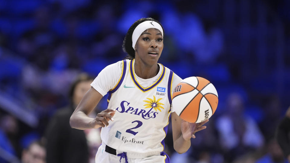 Los Angeles Sparks' Rickea Jackson handles the ball during a WNBA basketball game against the Dallas Wings in Arlington, Texas, Saturday, July 13, 2024. (AP Photo/Tony Gutierrez)