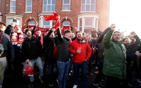 Liverpool fans outside Anfield - Credit: PA