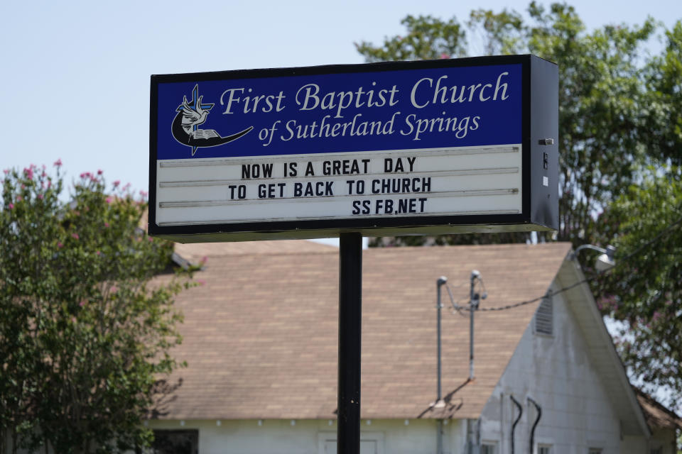 A sign is seen at the First Baptist Church in Sutherland Springs, Texas, Tuesday, July 2, 2024, which stands next to the old sanctuary that is now a memorial to the 26 people who were killed by a gunman in 2017. The 100-year-old building has served as a memorial since the shooting, but now some want to raze the building. (AP Photo/Eric Gay)