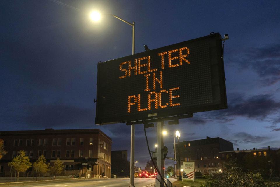 A sign advises residents to stay home, Thursday, Oct. 26, 2023, following a mass shooting at a restaurant and a bowling alley in Lewiston, Maine. Police continue to search for the suspect. | Robert F. Bukaty, Associated Press