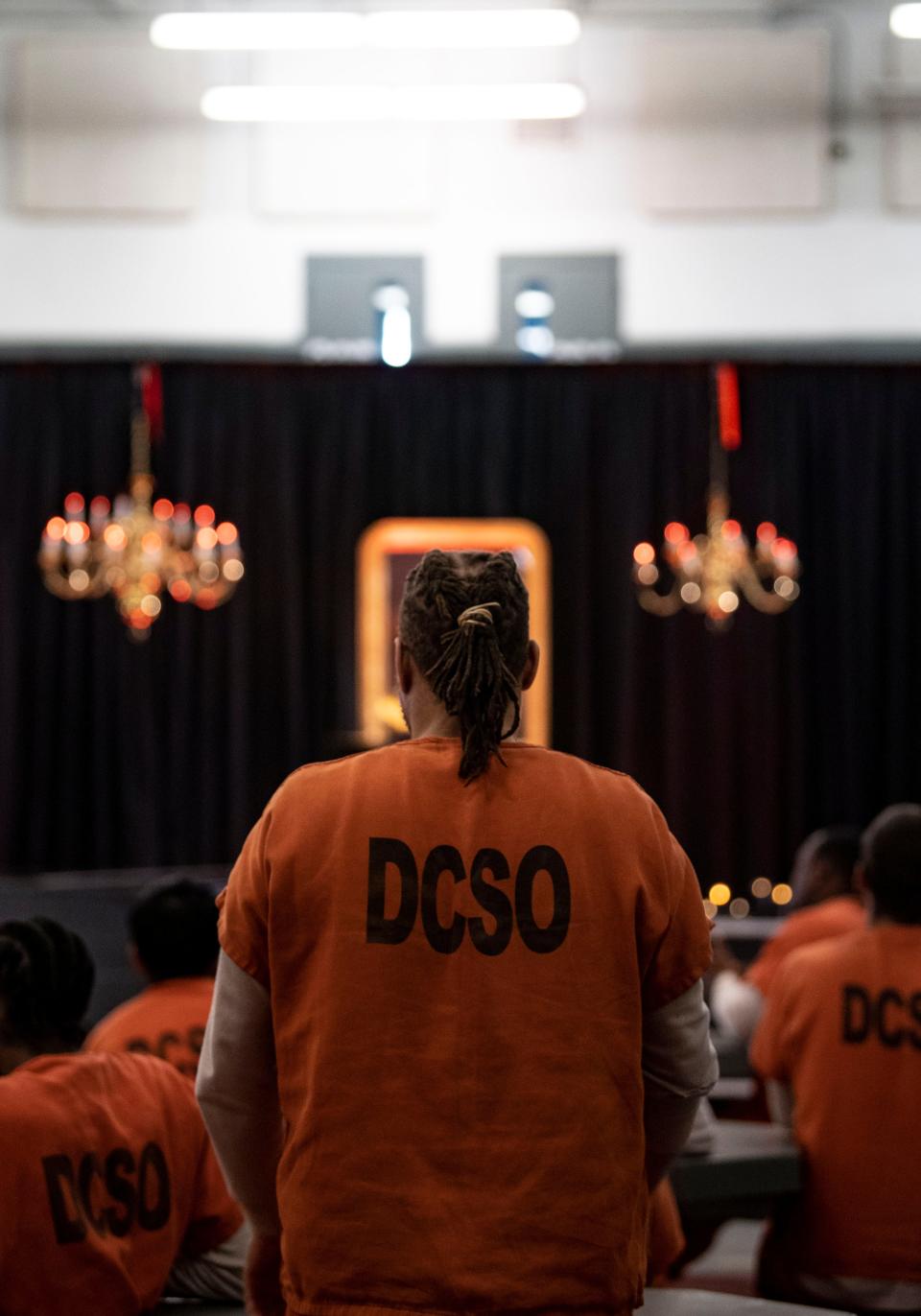 An inmate stands up while listening to Blessing Offor perform during the Send Musicians to Prison event at the Metro Detention Facility in Nashville, Tenn., Monday, Nov. 6, 2023.