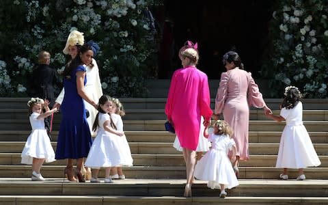 The Duchess of Cambridge (front left) arrives with the bridesmaids at St George's Chapel at Windsor Castle - Credit: Jane Barlow/PA Wire