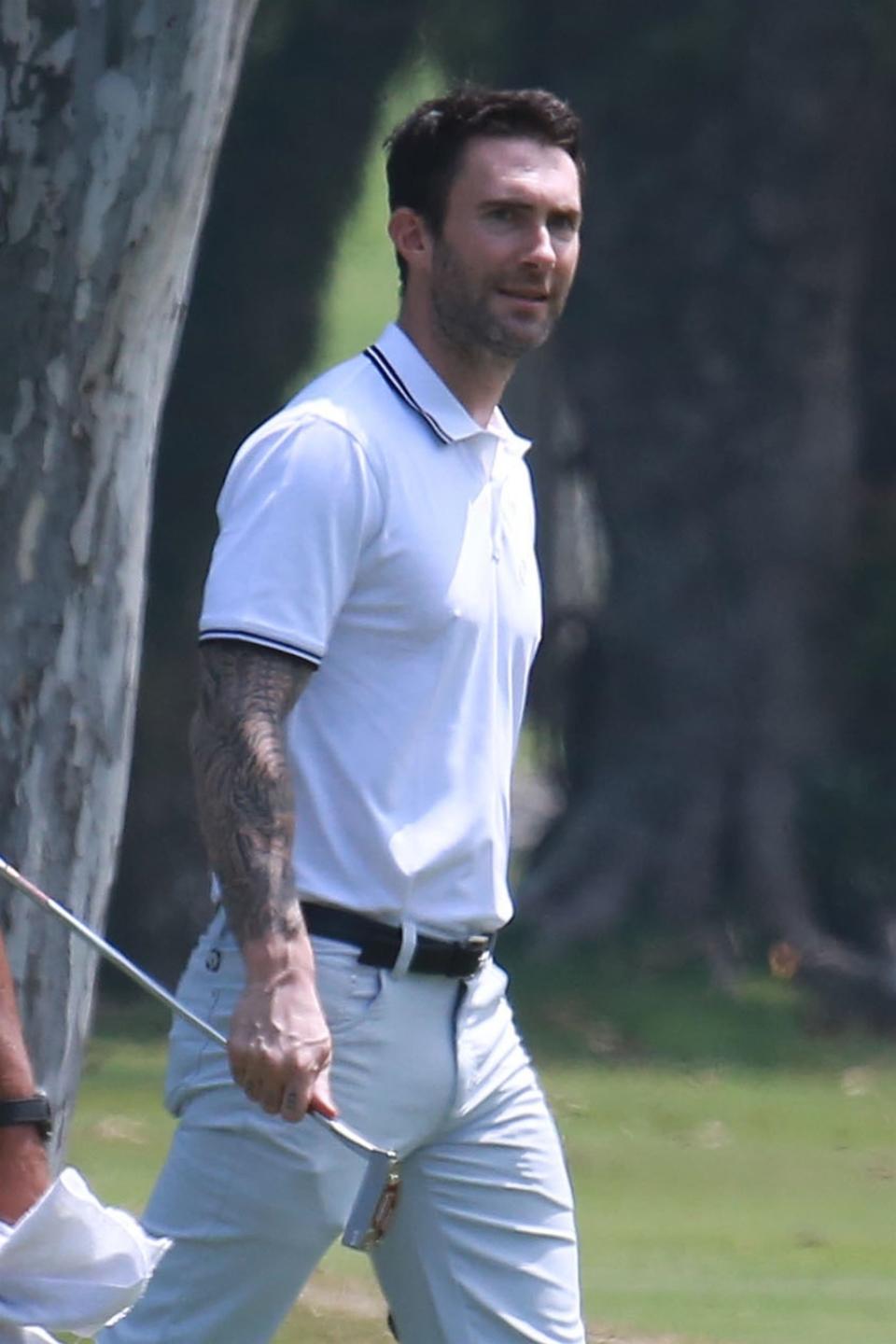 <p>Rockers need a day off, too. So the Maroon 5 singer hit the links with some pals in Rio di Janeiro, where he and his band played the Rock in Rio music festival. (Photo: Backgrid) </p>