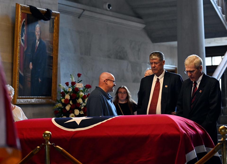 Deke Sundquist, right, and David Williamson, pay their respects to Republican Gov. Don Sundquist as he lies in state in the rotunda of the State Capitol Tuesday, Sept. 5, 2023, in Nashville, Tenn.