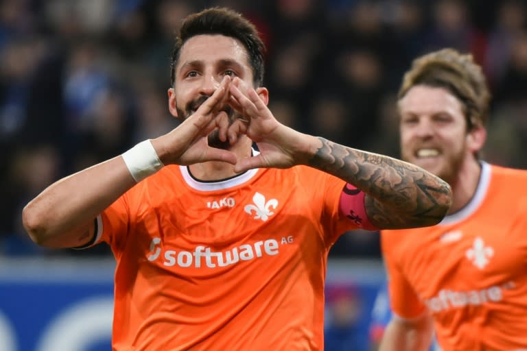 Darmstadt's defender Aytac Sulu celebrates scoring during a Bundesliga match against Darmstadt 98 in Sinsheim, southern Germany, on February 7, 2016