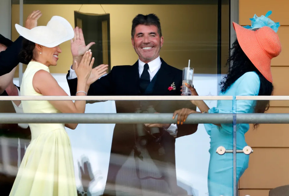 Lauren Silverman, Simon Cowell and Sinitta watch the racing as they attend day 1 of Royal Ascot at Ascot Racecourse on June 15, 2021 in Ascot, England. (Photo by Max Mumby/Indigo/Getty Images)