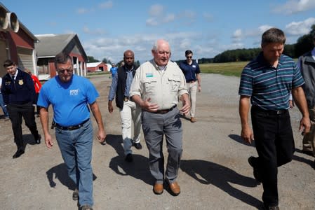 FILE PHOTO: U.S. Agriculture Secretary Sonny Perdue (C) tours the Brabant Farms in Verona, New York