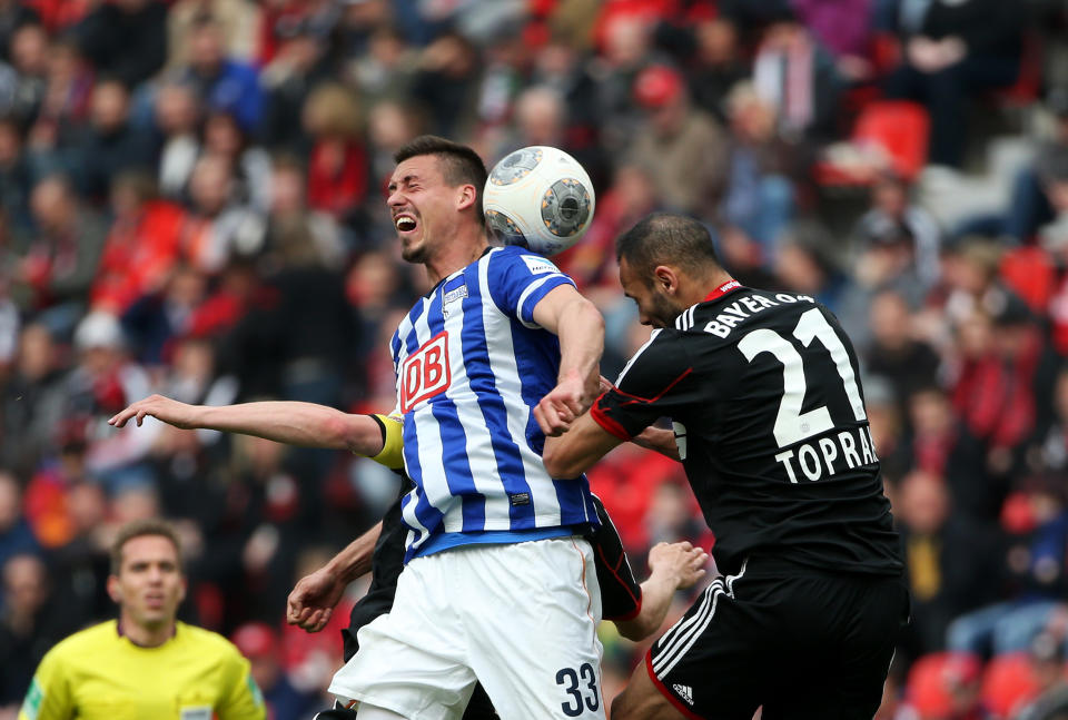 Leverkusen's Ömer Toprak, right, and Berlin's Sandro Wagner vie for the ball during the German first division Bundesliga soccer match between Bayer 04 Leverkusen and Hertha BSC Berlin at the BayArena in Leverkusen, Germany, April 13, 2014. (AP Photo/Rolf Vennenbernd/dpa)