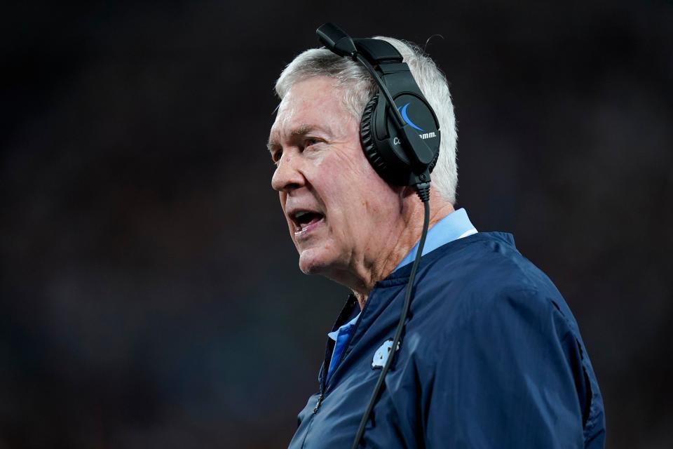 North Carolina head coach Mack Brown talks to his players in the first half of an NCAA college football game against South Carolina, Saturday, Sept. 2, 2023, in Charlotte, N.C. (AP Photo/Erik Verduzco)