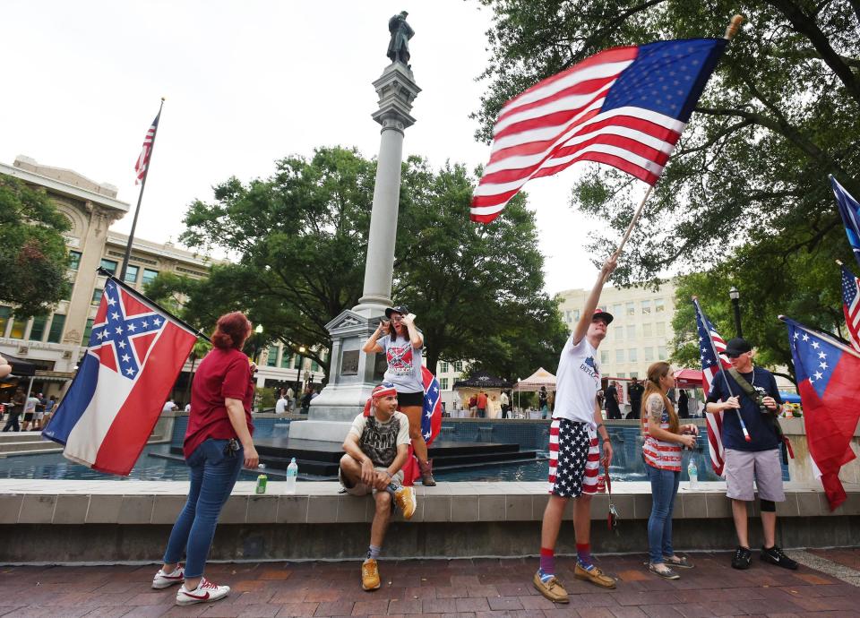 Flag-waving defenders of the Confederate monument in what is now James Weldon Johnson Park across from City Hall made their presence known in 2017. The soldier statue atop the monument and bronze plaques were removed in 2020.
