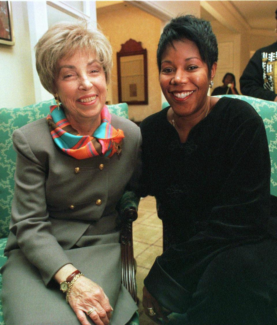 FILE - In this Jan. 16, 1998 file photo, Barbara Henry, a former teacher at William Frantz Elementry school in New Orleans, left, and her 1960 first grade student Ruby Bridges-Hall, pose for a portrait in Boston. Ruby Bridges will be one of the presenting authors at this weekend’s New Orleans Children’s Book Festival, an event Bridges helped launch in 2010. (AP Photo/Steven Senne, file)