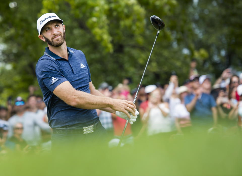 Dustin Johnson, of the United States, hits his tee shot on the first hole during the final round of the Canadian Open at the Glen Abbey Golf Club in Oakville, Ontario, Sunday, July 29, 2018. (Nathan Denette/The Canadian Press via AP)