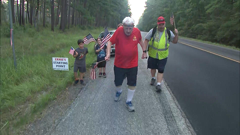 Andrus marches across the country with supporters in tow.  / Credit: CBS News