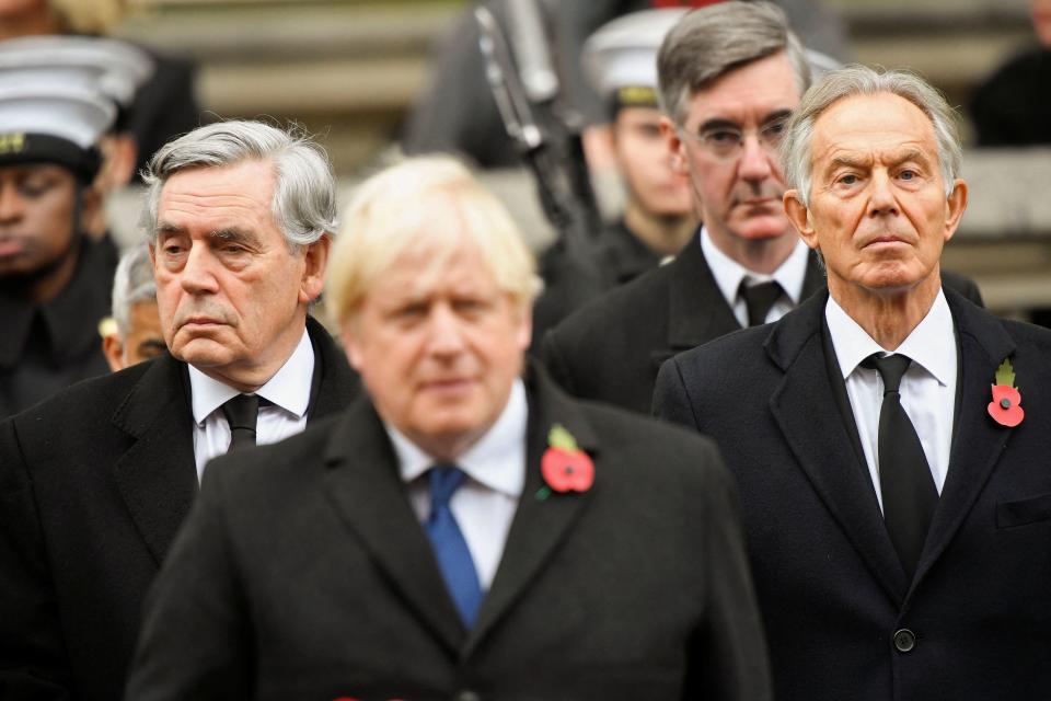 (L-R) Former British Prime Minister Gordon Brown, Britain's Prime Minister Boris Johnson, Britain's Leader of the House of Commons Jacob Rees-Mogg and former British Prime Minister Tony Blair attend the Remembrance Sunday ceremony at the Cenotaph on Whitehall in central London, on November 14, 2021. - Remembrance Sunday is an annual commemoration held on the closest Sunday to Armistice Day, November 11, the anniversary of the end of the First World War and services across Commonwealth countries remember servicemen and women who have fallen in the line of duty since WWI. (Photo by TOBY MELVILLE / POOL / AFP) (Photo by TOBY MELVILLE/POOL/AFP via Getty Images)