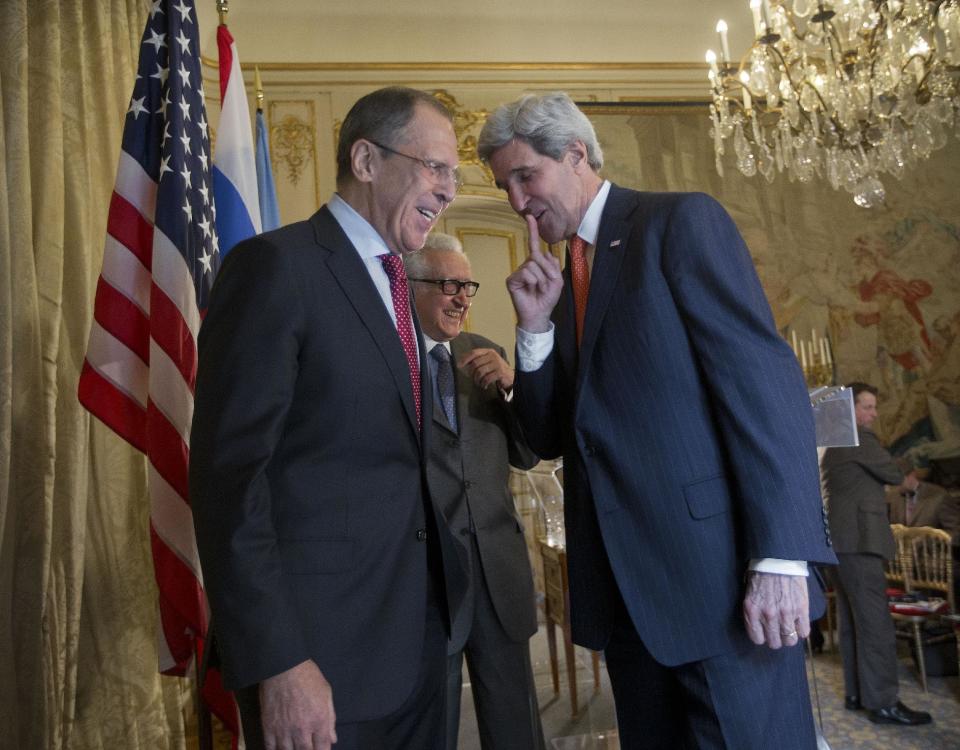 US Secretary of State John Kerry, right, with with Russia's Foreign Minister Sergey Lavrov, left, and U.N-Arab League envoy for Syria Lakhdar Brahimi, center, on stage following the conclusion of their joint news at the US Ambassador's residence in Paris, France, Monday, Jan. 13, 2014. Kerry is in Paris for meetings on Syria to rally international support for ending the three-year civil war in Syria. (AP Photo/Pablo Martinez Monsivais, Pool)