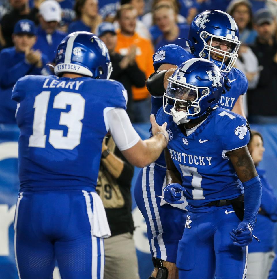 Kentucky receiver Barion Brown (7) celebrates with quarterback Devin Leary after the team's first touchdown Saturday night against Tennessee.