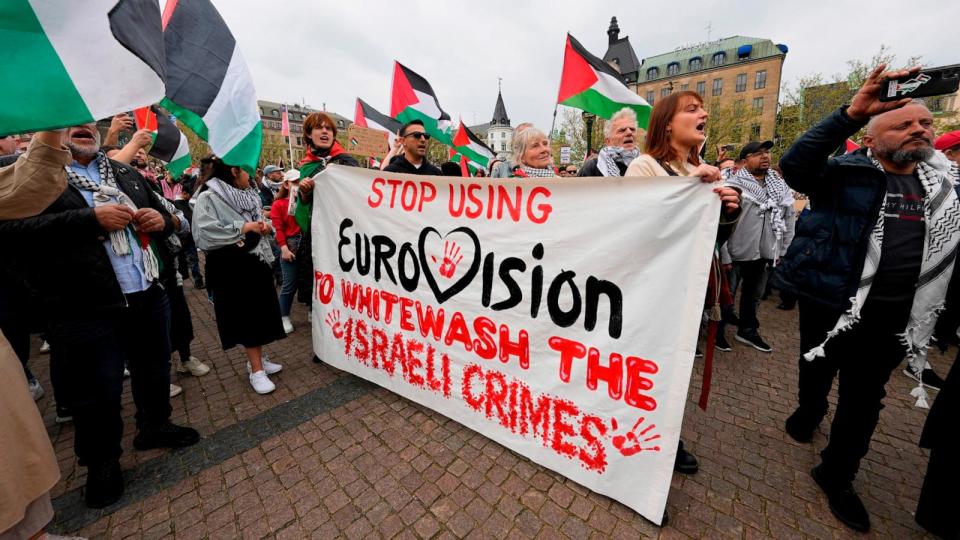 PHOTO: People carry a banner and wave Palestinian flags during a pro-Palestinian demonstration for excluding Israel from Eurovision ahead of the second semifinal at the Eurovision Song Contest in Malmo, Sweden, Thursday, May 9, 2024. (Martin Meissner/AP)