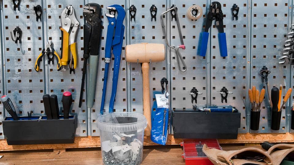 Set of tools on the wall cupboard.