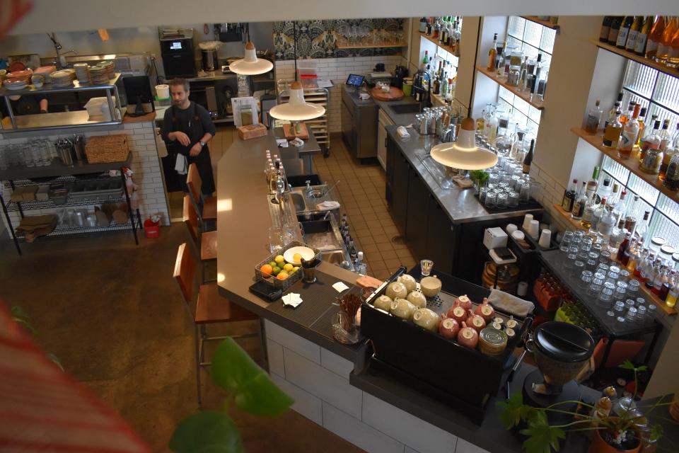 Persimmon owner Raffi Jergerian walks through the kitchen in the cafe and cocktail bar Dec. 19, 2023 in Fort Collins, Colo.