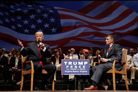 Republican presidential nominee Donald Trump (L) speaks along side retired U.S. Army Lieutenant General Mike Flynn during a campaign town hall meeting in Virginia Beach, Virginia, U.S., September 6, 2016. REUTERS/Mike Segar