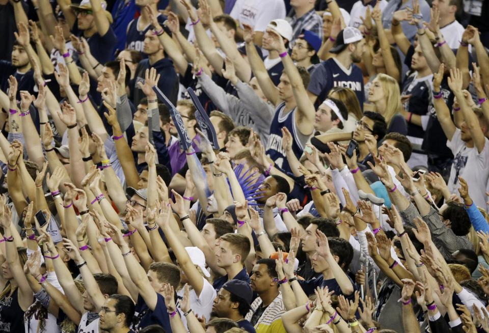 Connecticut fans show their support during the second half of the NCAA Final Four tournament college basketball semifinal game against Florida Saturday, April 5, 2014, in Arlington, Texas. (AP Photo/Tony Gutierrez)