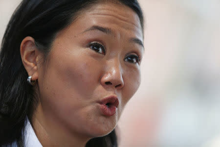 Peruvian presidential candidate Keiko Fujimori of Fuerza Popular (Popular Force) party talks to the media during a visit to a recycling plant in San Juan de Lurigancho in Lima, Peru, May 4, 2016. REUTERS/Mariana Bazo