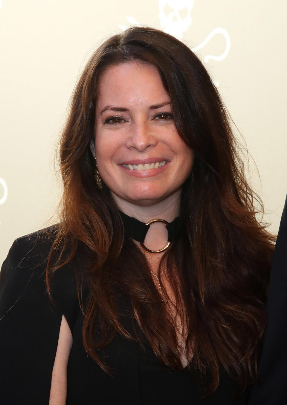 Holly Marie Combs who played Piper in the original ‘Charmed’ has fired back against the new producer of the 2018 version of the show. Source: Getty