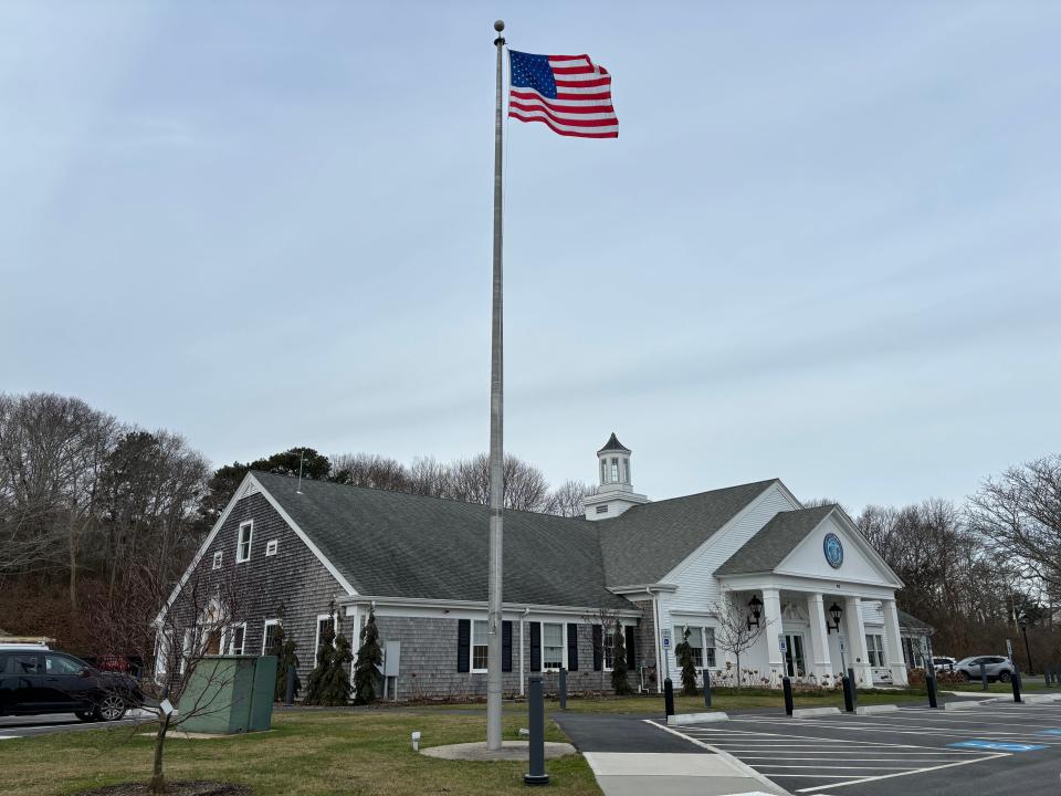 The American flag flaps in the wind on Thursday outside Sandwich Town Hall. After receiving a request from an anti-abortion group to fly its flag on a town flagpole, the Sandwich Board of Selectmen adopted a flag policy for town-owned flagpoles.