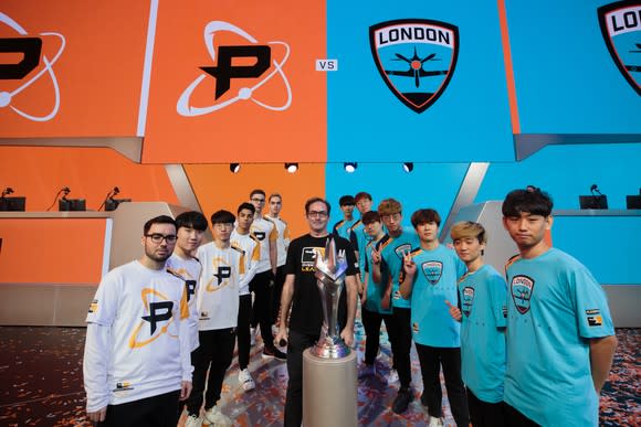 Members of the Philadelphia Fusion and the London Spitfire in a photo shoot before the Overwatch League Grand Finals.