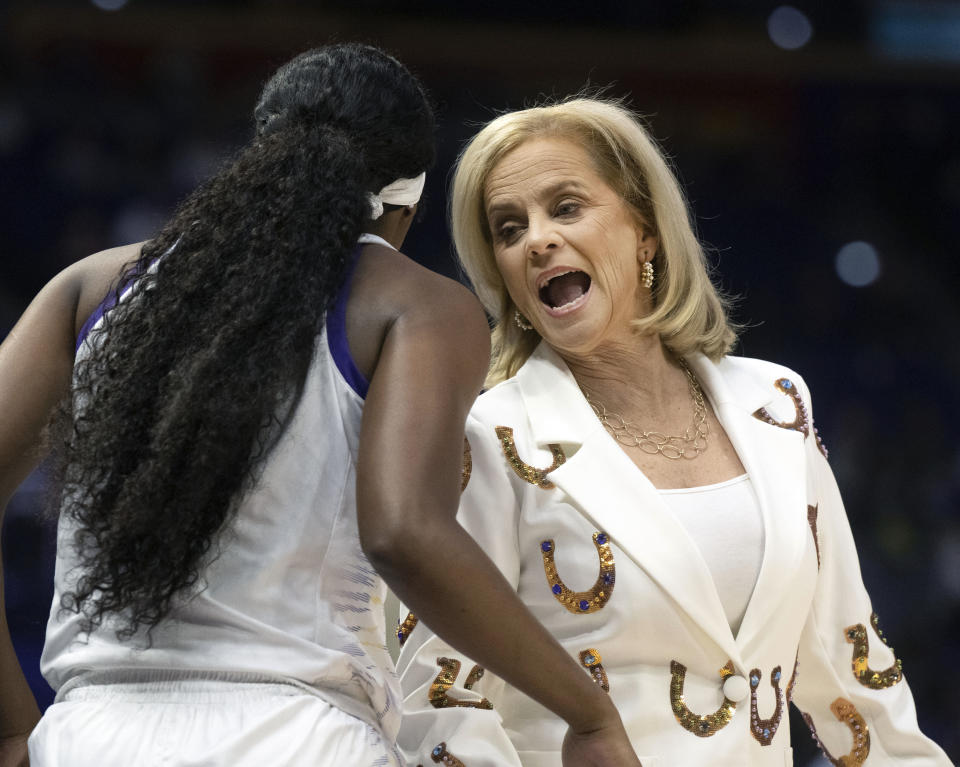 LSU head coach Kim Mulkey speaks with LSU forward Amani Bartlett before sending her into the game against McNeese during an NCAA basketball game, Tuesday, Dec. 12, 2023, in Baton Rouge, La. (Hilary Scheinuk/The Advocate via AP)