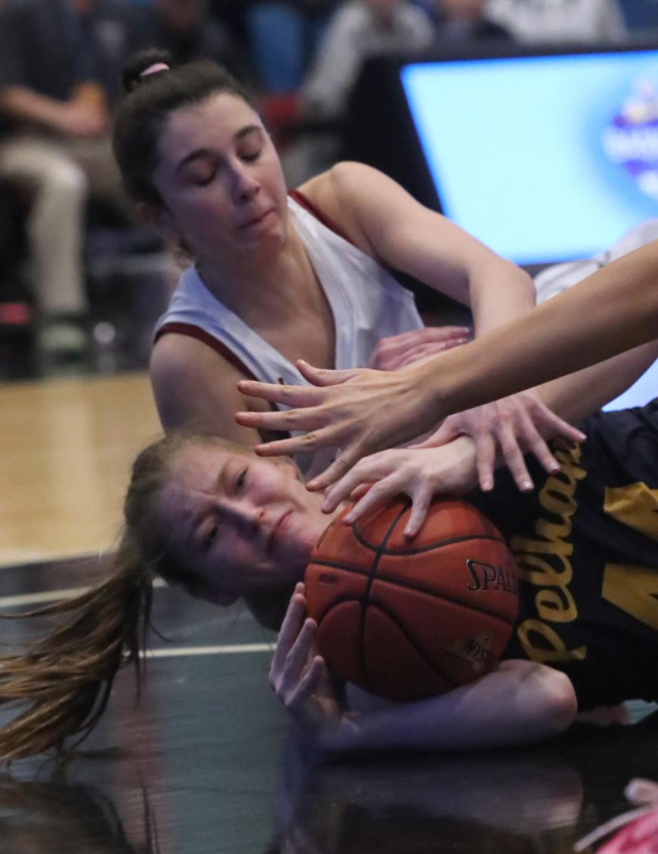 Albertus' Sophia Malpeli, top, fights for a loose ball with Pelham's Taylor Green during their Class AA Girls Semifinal at the Westchester County Center Feb. 26, 2024. Albertus won 68-32.