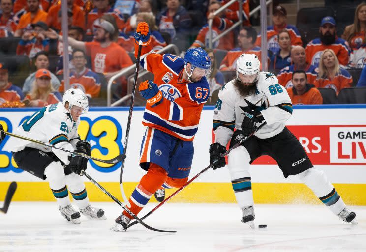 Benoit Pouliot of the Edmonton Oilers battles for the puck with Brent Burns #88 in Game 1 of the Stanley Cup Playoffs. (Photo by Codie McLachlan/Getty Images)