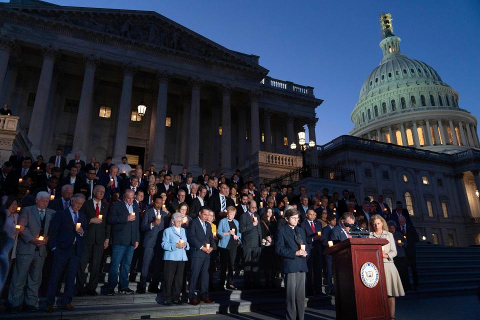 Members of Congress have moment of silence as they host a candlelight vigil for Israel at the Capitol in Washington, Thursday, Oct. 12, 2023.