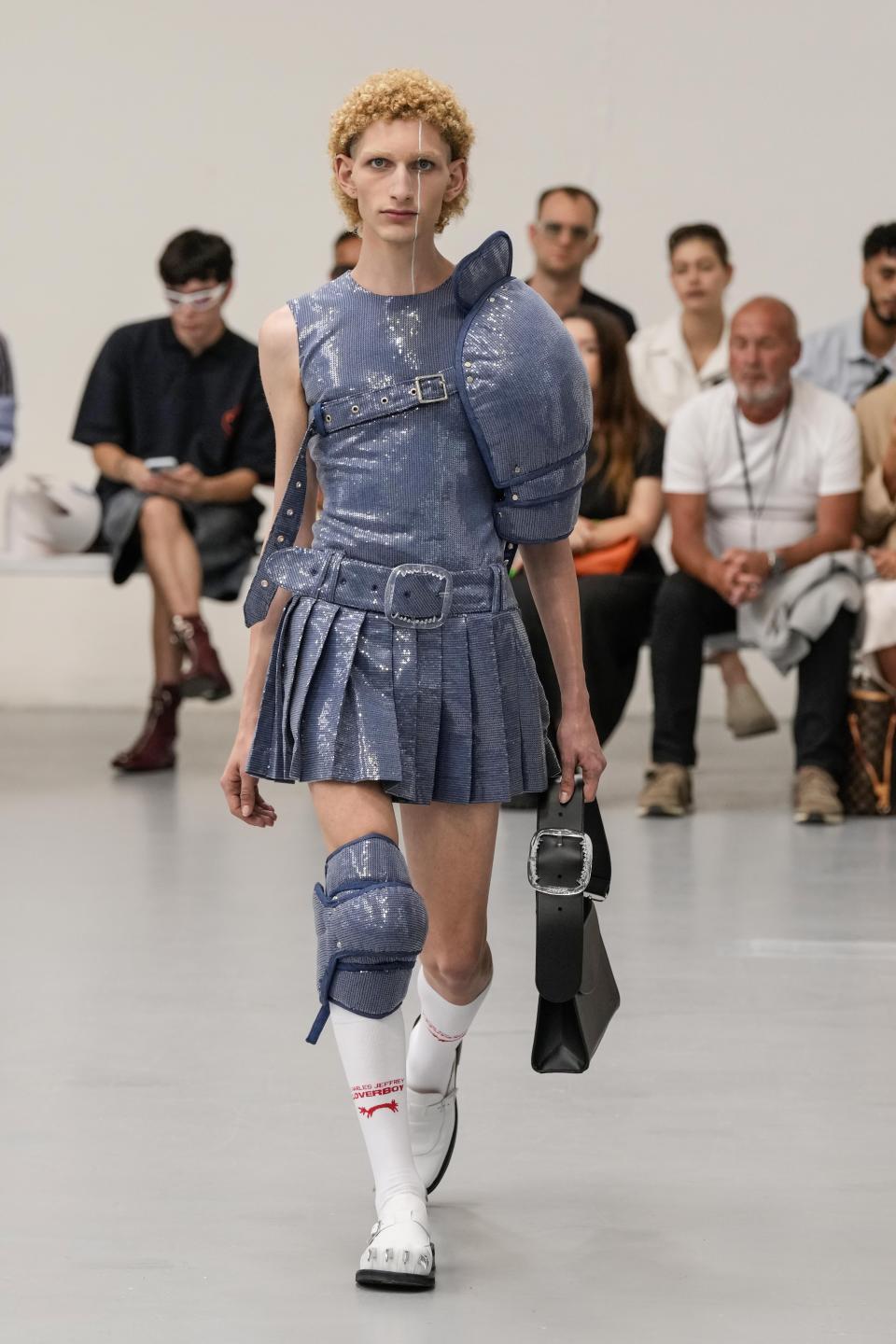 A model wears a creation as part of the Jeffrey Loverboy men's Spring Summer 2024 collection presented in Milan, Italy, Sunday, June 18, 2023. (AP Photo/Antonio Calanni)