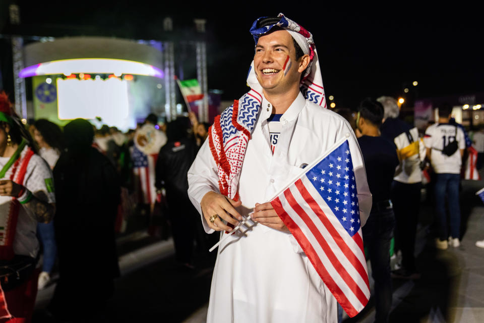 Chris Ayres, an American soccer fan from Texas, wears a ghutra patterned after the flag of the U.S. while attending the World Cup in Doha, Qatar, on Nov. 29, 2022. ÒI was doing my best to research before buying it; I didnÕt want to be disrespectful in any way,Ó he says. ÒThe reaction has been positive.Ó (Erin Schaff/The New York Times)