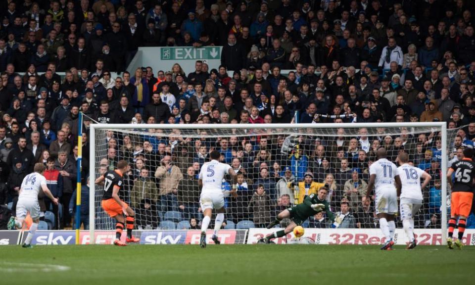 Robert Green tips Jordan Rhodes’ penalty on to a post.