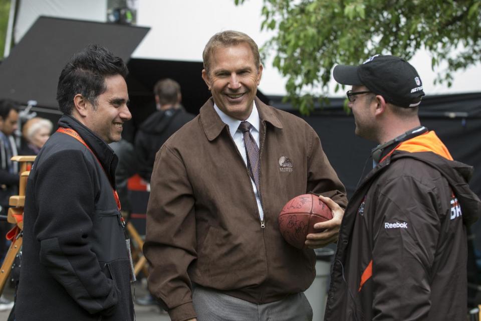 This image released by Summit Entertainment shows Rajiv Joseph, left, Kevin Costner, center, and Scott Rothman in a scene from "Draft Day." (AP Photo/Summit Entertainment, Dale Robinette)