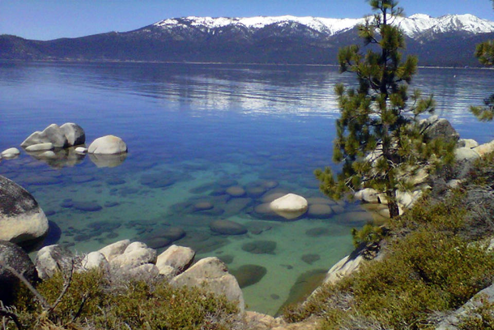 FILE - This April 12, 2012, file photo, shows the clarity of Lake Tahoe, Nev. The clarity of Lake Tahoe's cobalt blue water improved last year from its worst level in a half-century as weather and runoff returned to more normal conditions. Scientists say a plate-sized disc used to measure clarity was visible at an average depth of 70.9 feet in 2018, which is an improvement of 10.5 feet from 2017. Scientists hope efforts to combat threats to clarity posed by development and climate change will eventually return Lake Tahoe to its historical clear depth of 100 feet. (AP Photo/Scott Sonner, File)