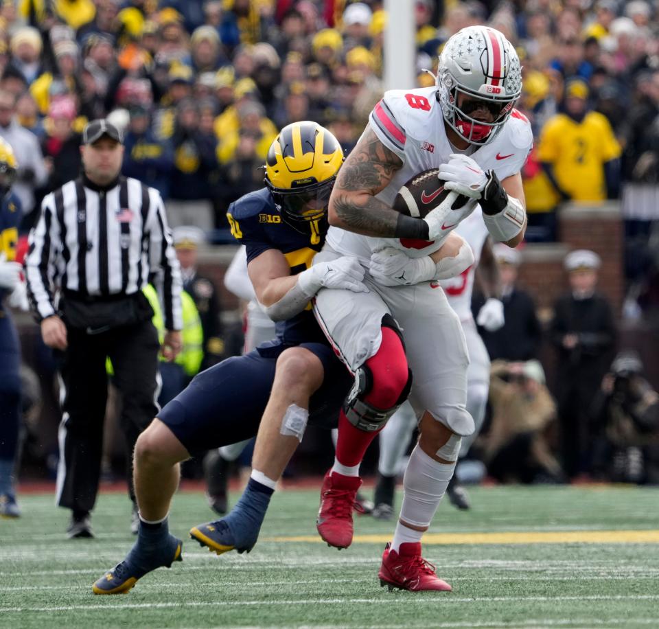 Nov. 25, 2023; Ann Arbor, Mi., USA;
Ohio State Buckeyes tight end Cade Stover (8) is tackled by University of Michigan linebacker Jimmy Rolder (30) during the first half of SaturdayÕs NCAA Division I football game at Michigan Stadium.