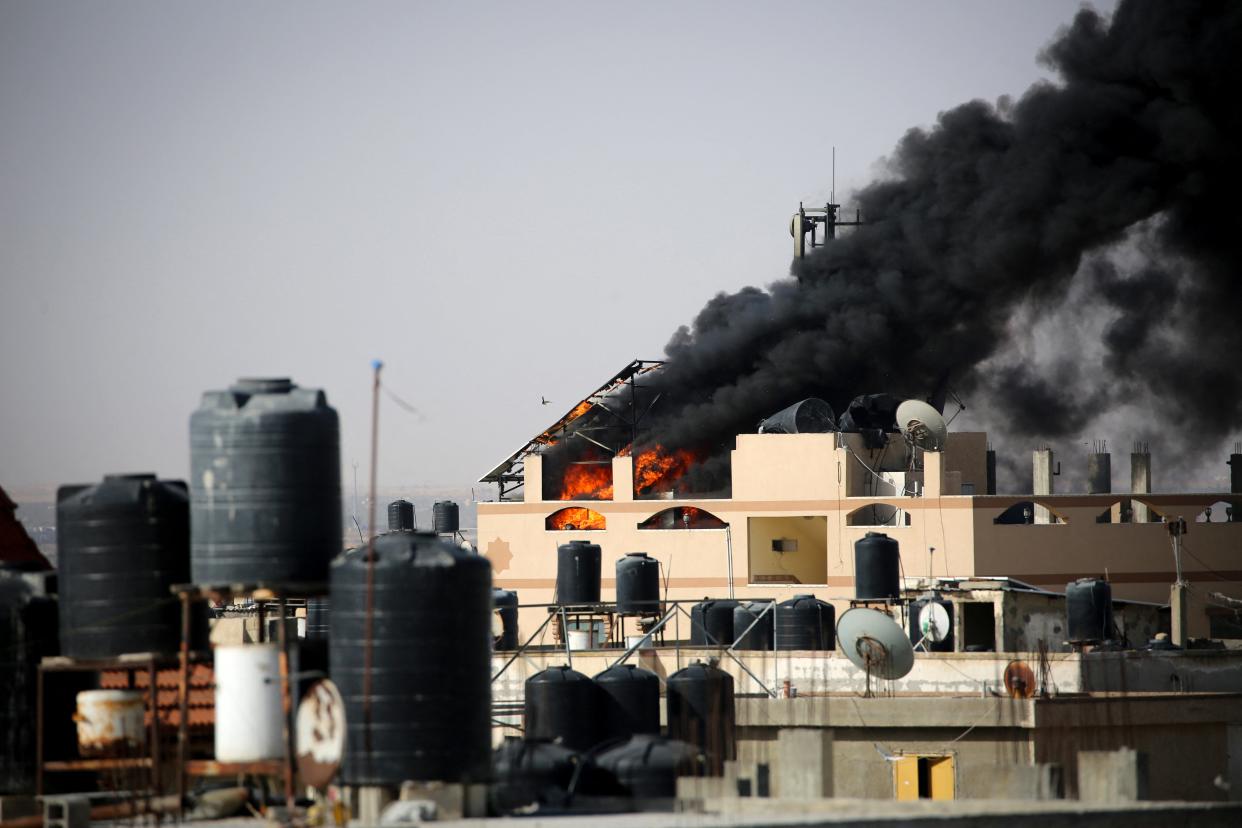 Thick, black smoke rises from a fire in a building caused by Israeli bombardment in Rafah in the southern Gaza Strip (AFP via Getty Images)