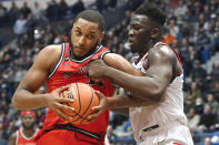 UConn's Adama Sanogo, right, fouls St. John's Joel Soriano in the second half of an NCAA college basketball game, Sunday, Jan. 15, 2023, in Hartford, Conn. (AP Photo/Jessica Hill)