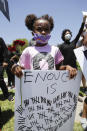 Sabrina Murphy, 6, holds a sign Thursday June, 4, 2020 in Santa Clarita, Calif., during a protest over the death of George Floyd who died May 25 after he was restrained by Minneapolis police. (AP Photo/Marcio Jose Sanchez)