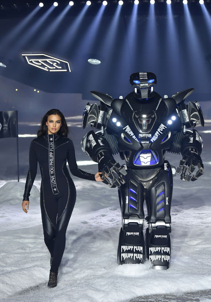 <p>Irina Shayk walks hand-in-hand with Philipp Plein’s Transformers robot. (Photo: Getty) </p>