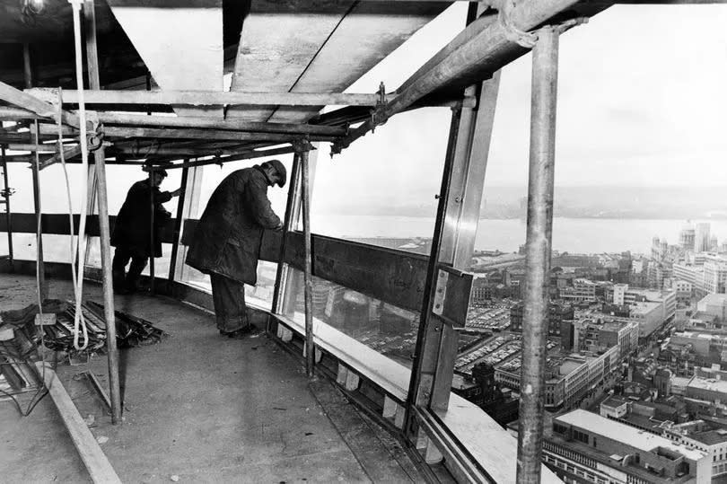 Work going ahead on the fitting of windows in the revolving restaurant on the Ravenseft Beacon. 30th January 1969.